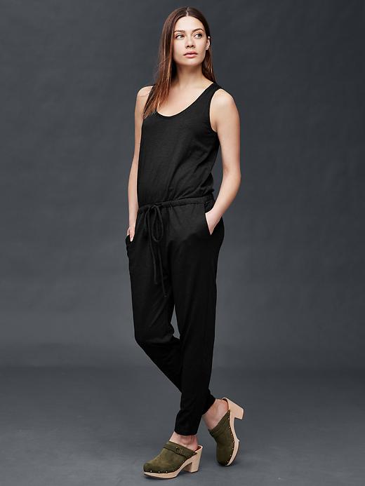 View large product image 1 of 1. Sleeveless tie jumpsuit