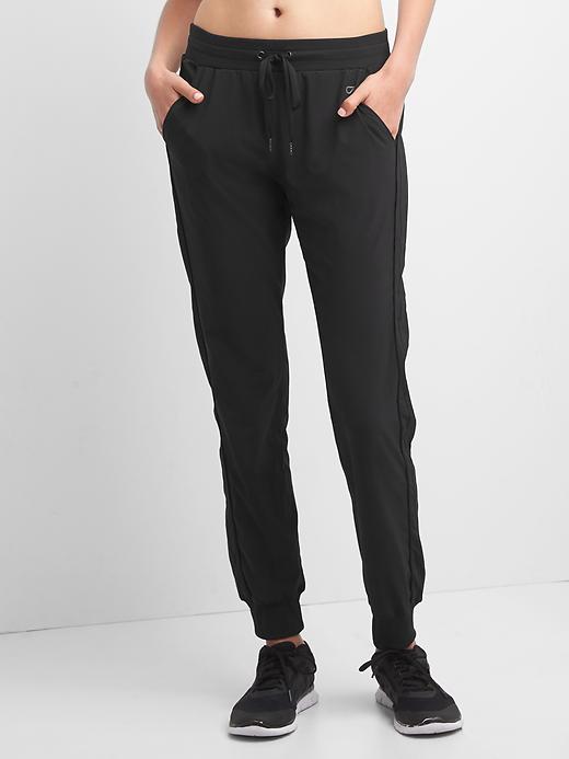 View large product image 1 of 6. GapFit Studio Side-Stripe Joggers
