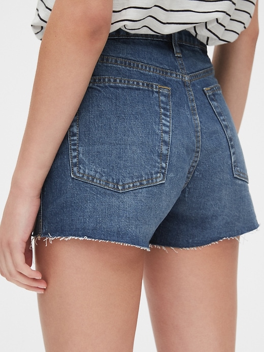 Image number 5 showing, High Rise Cheeky Denim Shorts with Raw Hem