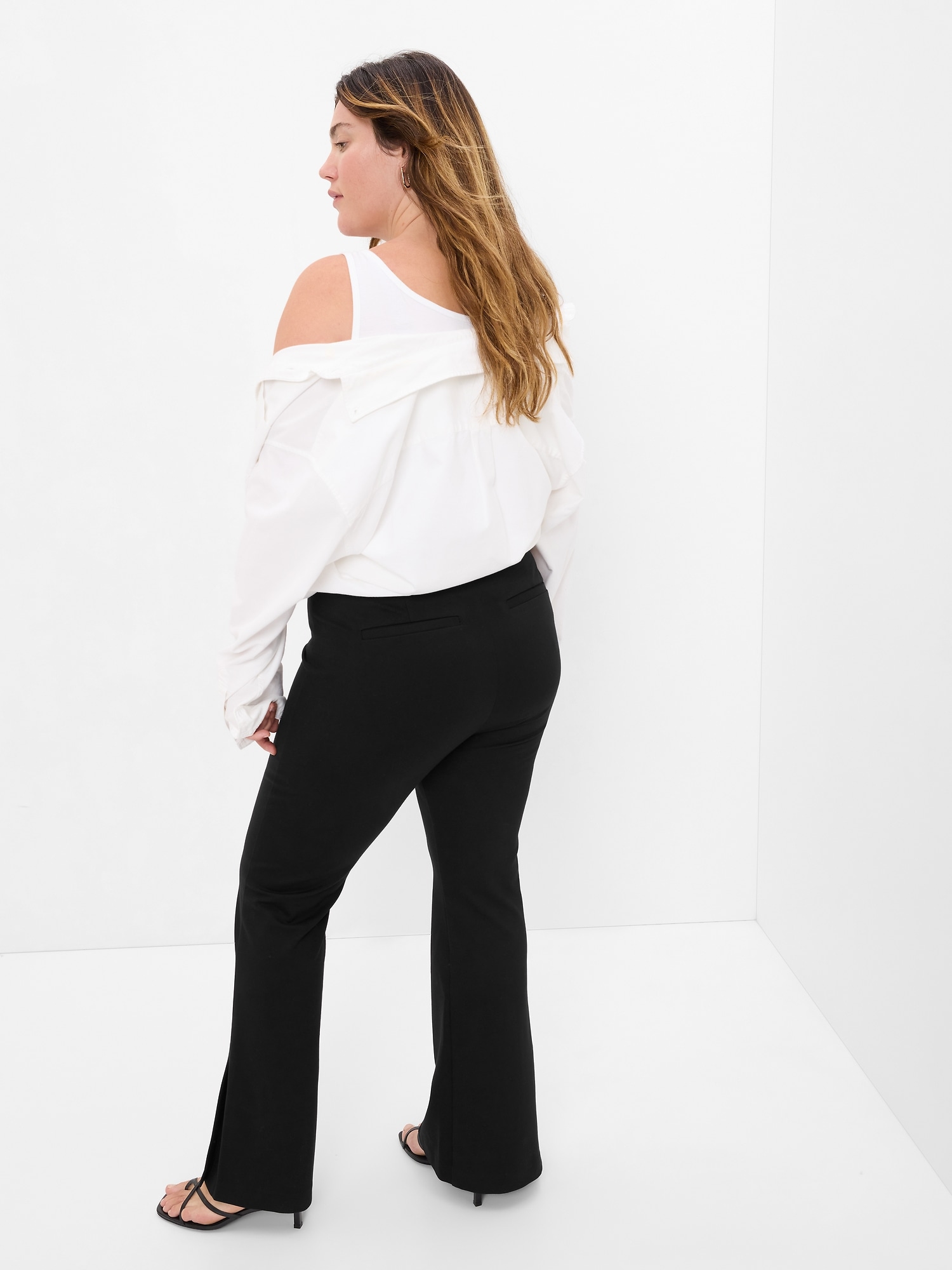 Black flared pants with ankle slit