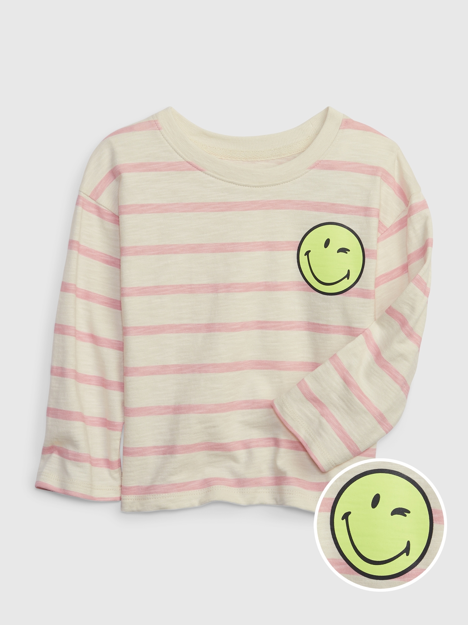 Gap × SmileyWorld® Toddler Striped Shirt pink. 1