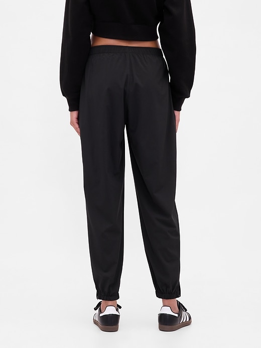 Image number 4 showing, GapFit Tech High Rise Zip-Hem Joggers