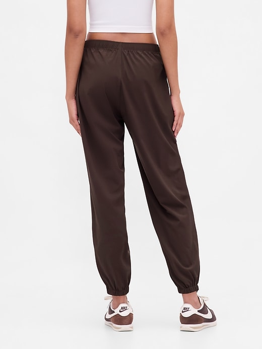 Image number 4 showing, GapFit Tech High Rise Zip-Hem Joggers