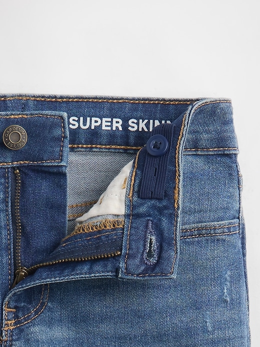 L'image numéro 7 présente Jean super moulant à taille basse moyenne pour Enfant