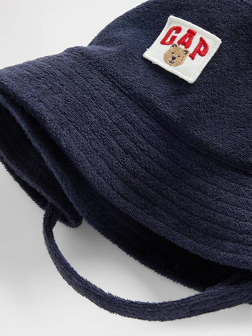 L'image numéro 1 présente Chapeau cloche en jersey bouclette à logo de l’ourson Brannan pour Bébé et Tout-petit