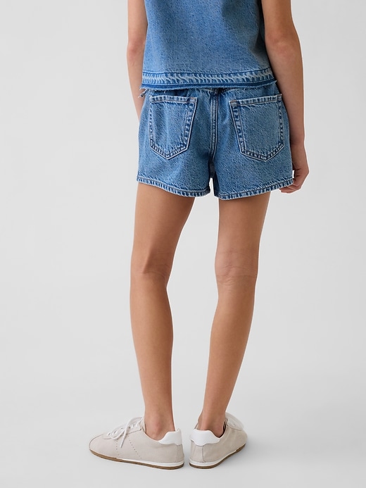 L'image numéro 3 présente Jupe-short portefeuille en denim pour Enfant