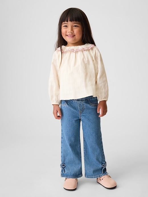Image number 1 showing, Baby & Toddler Bow Split-Hem Stride Jeans