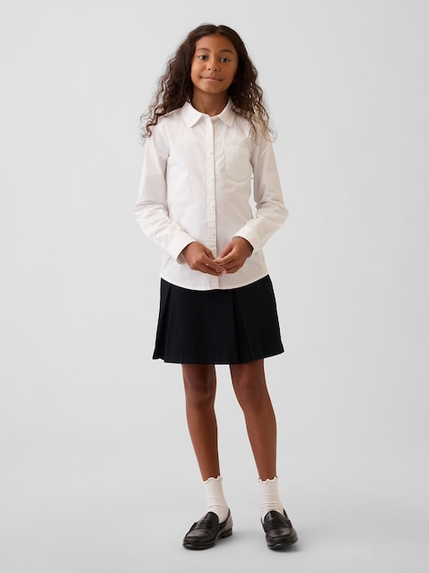 JUPE-SHORT KAKI D'UNIFORME À PLIS POUR ENFANT